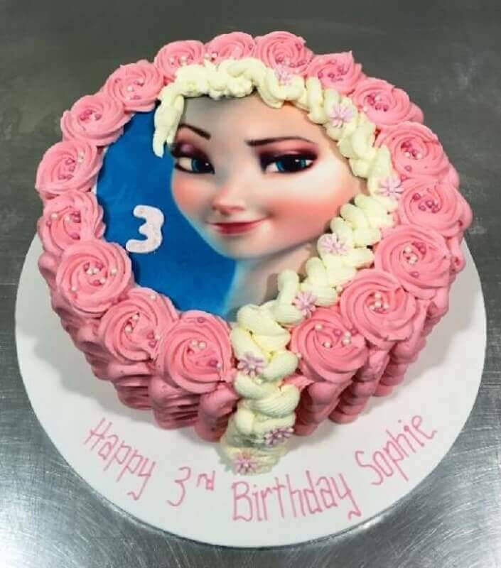 Frozen pink whipped cream cake with Elsa's face Photo Festas.Biz