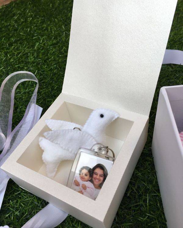 Personalized christening souvenirs with photo of the godparents
