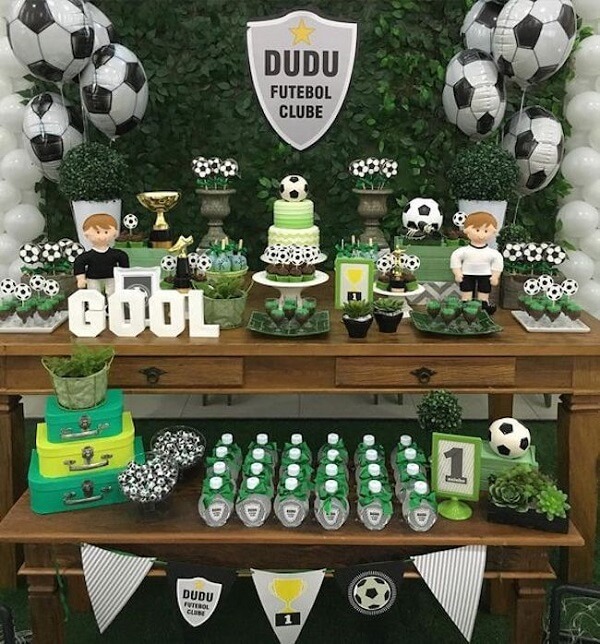 Distribute the football theme party candies all over the cake table