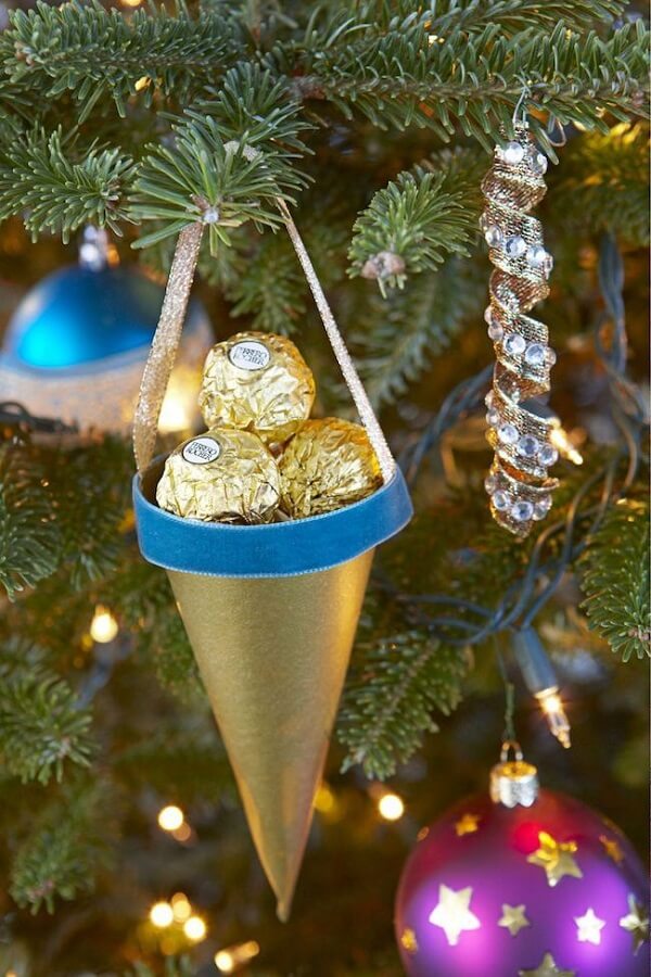 Golden cone with chocolates as a Christmas souvenir