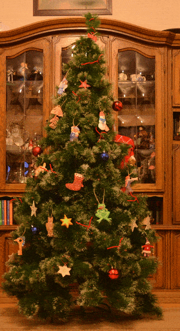 Christmas tree gif being decorated