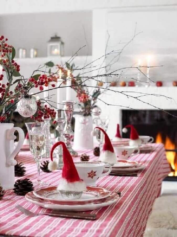 Simple Christmas table with little Santa hat on each plate Photo Pinterest