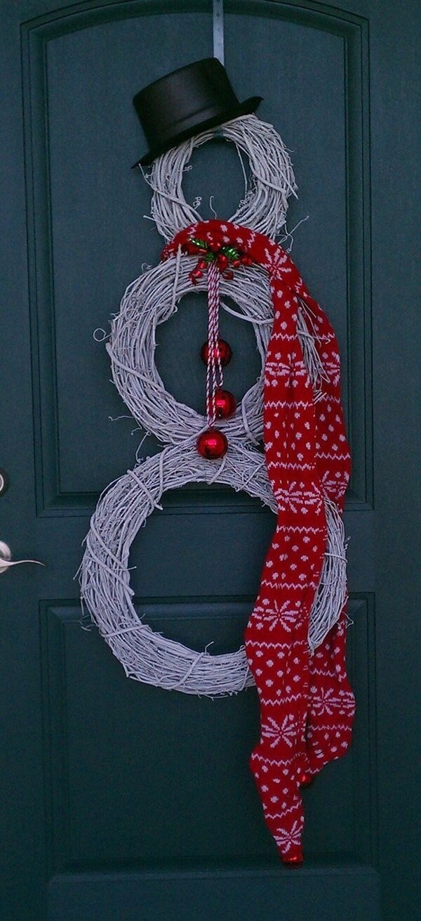 Handicraft christmas snowman with sticks on the door decoration